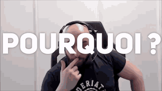 a man wearing headphones is sitting in front of a screen that says pourquoi