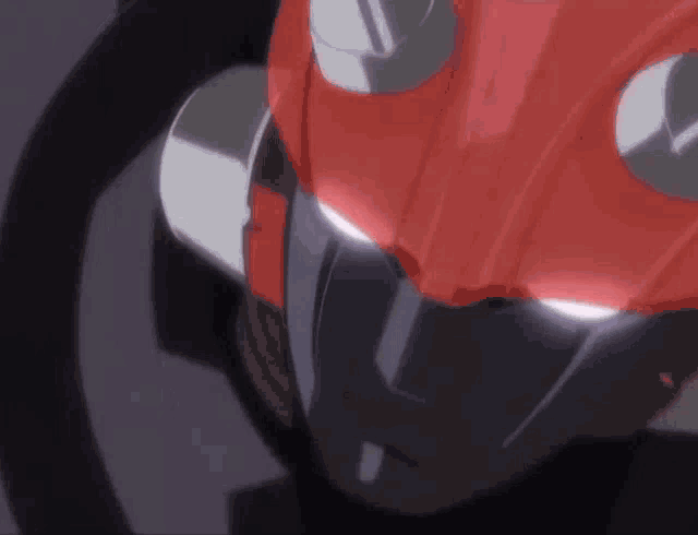 a close up of a robot 's head with its eyes glowing in the dark .