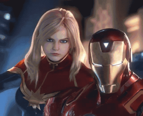 captain marvel and iron man pose for a picture together