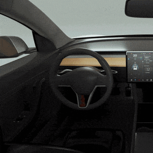 the inside of a car with a steering wheel and a screen that says 20 on it