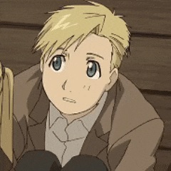 a young boy with blonde hair and blue eyes is wearing a brown jacket and tie .