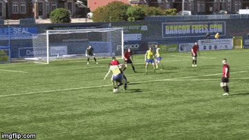 a soccer game is being played on a field with a sign that says super seal
