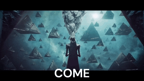 a woman stands in front of a wall of triangles with the word come above her