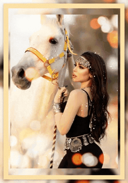 a woman is standing next to a white horse with a yellow bridle