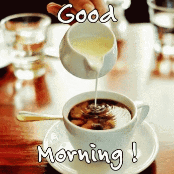 someone pouring milk into a cup of coffee with the words good morning