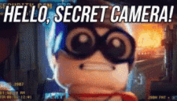 a cartoon character says hello secret camera while wearing a superhero costume