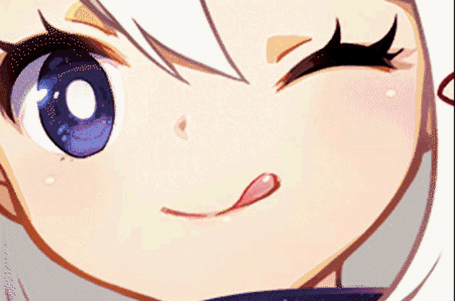 a close up of a girl 's face with a tongue out