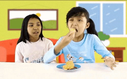 a girl wearing a shirt that says brooklyn is eating a piece of food