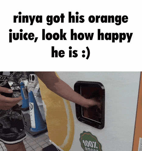 a person getting an orange juice from a machine that says 100 % on it