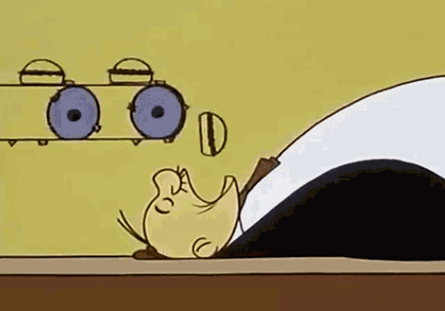 a cartoon of a man laying on a table with his head on a table .