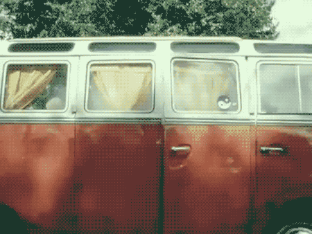 a red and white van with a sticker on the door that says ' a '
