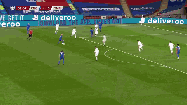 a soccer player with the number 22 on his back is hugging another player