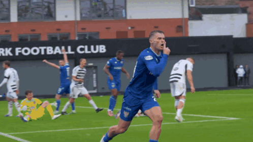 a soccer game is being played in front of a rk football club