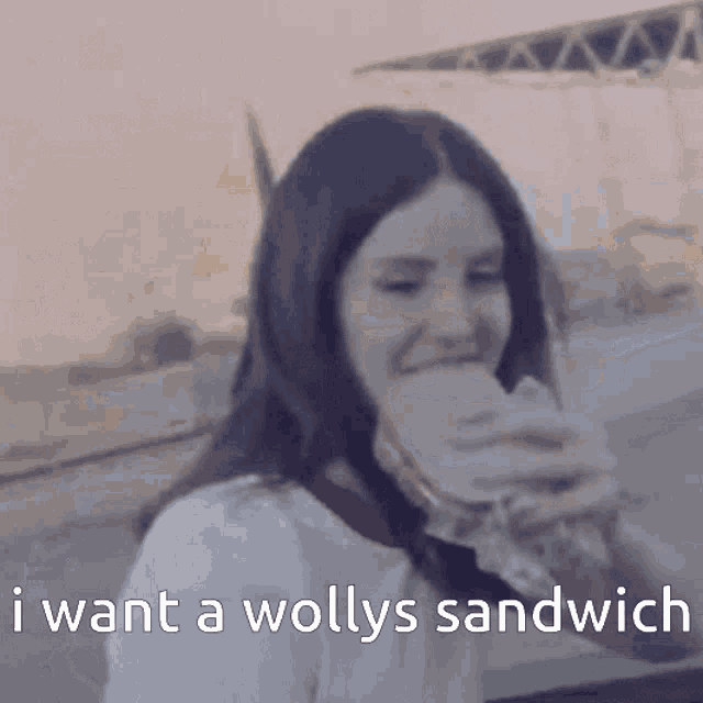 a woman is eating a sandwich with the words " i want a wollys sandwich " below her