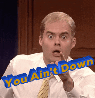 a man in a white shirt and tie holds up a sign that says you ain t down