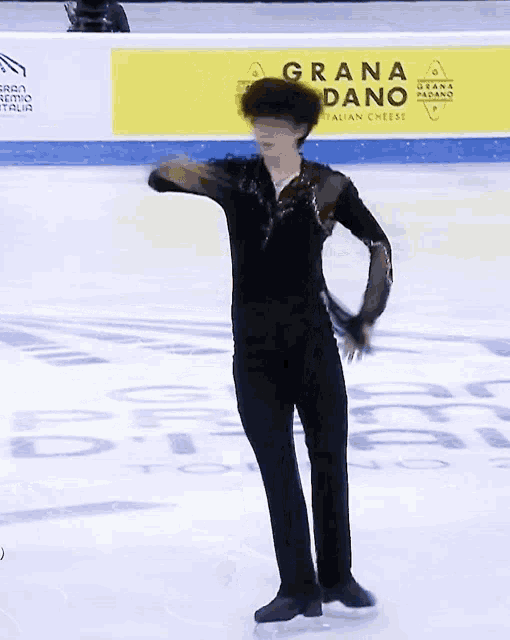 a man is ice skating in front of an ad for grana dano