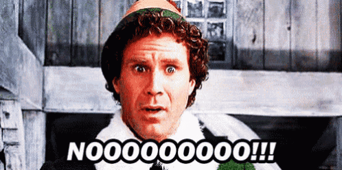 a man in an elf costume is standing in front of a wooden wall and says nooooooo !!