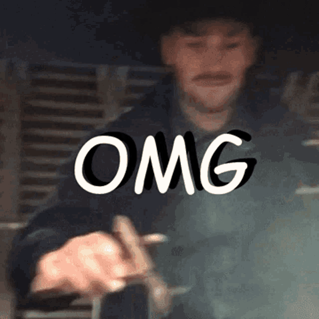 a man in a cowboy hat with the word omg written on the bottom