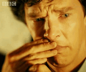 a close up of a man 's face with bbc written on the bottom