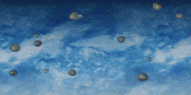 a bunch of rocks are flying through a blue sky
