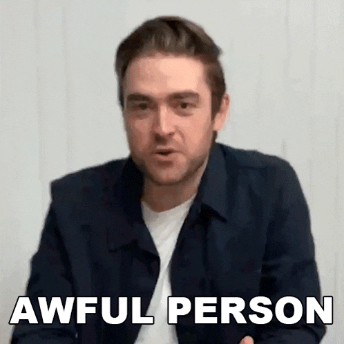 a man in a black jacket is making a funny face and saying awful person .