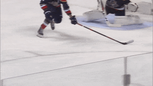 a hockey player with the number 88 on his jersey stands on the ice