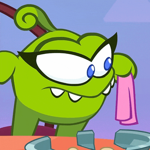 a green cartoon character holding a pink cloth