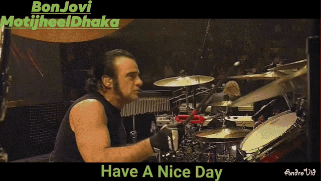 a video of a man playing drums with the words have a nice day below him