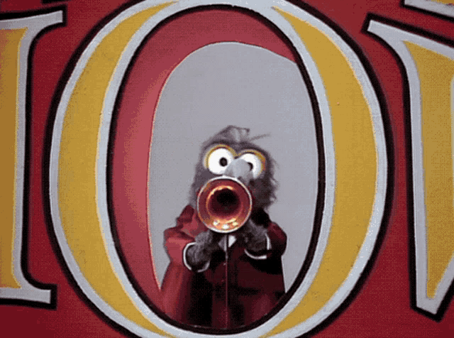 a cartoon character playing a trumpet in front of a large o