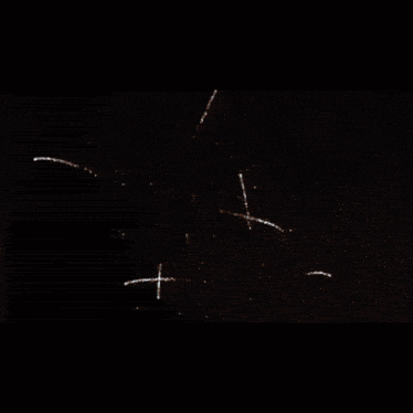 a happy new year greeting card with fireworks behind it