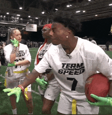 a man in a white jersey that says team speed on it