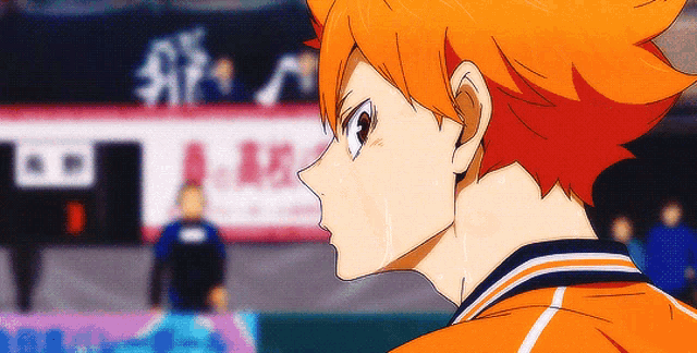 a close up of a person 's face with orange hair and sweat coming out of their nose .