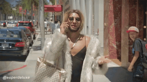 a man in a fur coat is talking on a cellphone
