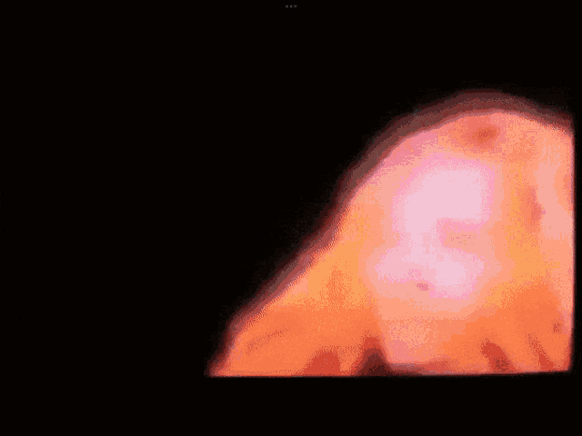 a close up of a person 's face with a pink background
