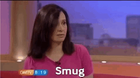 a woman in a pink shirt is talking on gmtv at 8:19