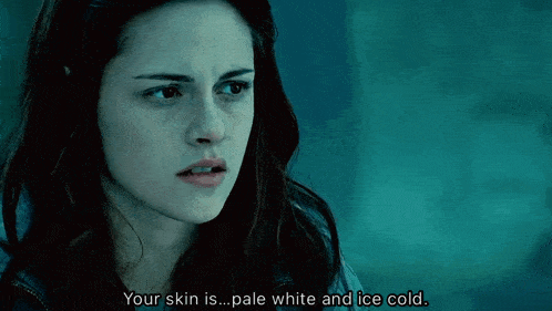 a close up of a woman 's face with the words your skin is pale white and ice cold below her