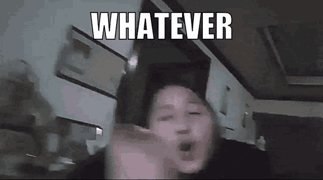 a person is making a funny face with the words `` whatever '' written on it .