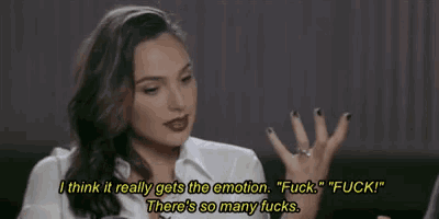 a woman is sitting on a couch talking to a man and says `` i think it really gets the emotion '' .