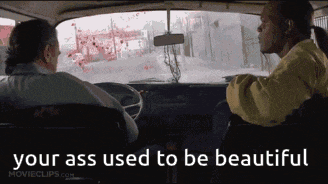 two men in a car with the words " your ass used to be beautiful " on the screen