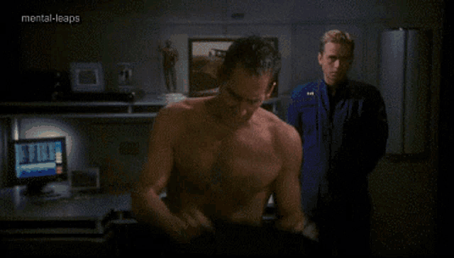 a man without a shirt is standing next to another man with mental-leaps written on the bottom of the screen