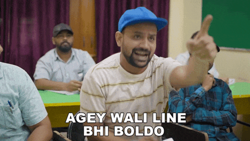 a man sitting in a classroom with the words agey wali line bhi boldo