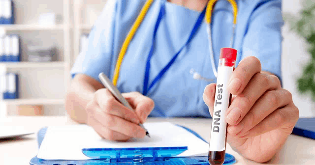 a doctor is holding a test tube that says dna test