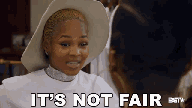 a woman in a white hat says it 's not fair bet