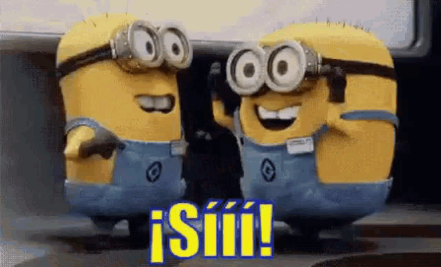two minions wearing goggles and overalls are standing next to each other and laughing .