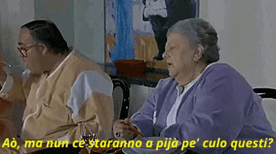 a man and a woman are sitting at a table with a caption that says ao ma nun ce staranno