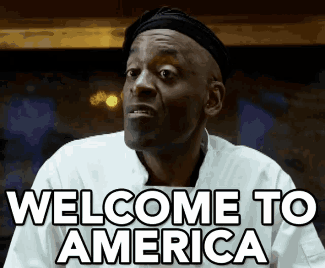 a man in a chef 's uniform says " welcome to america "