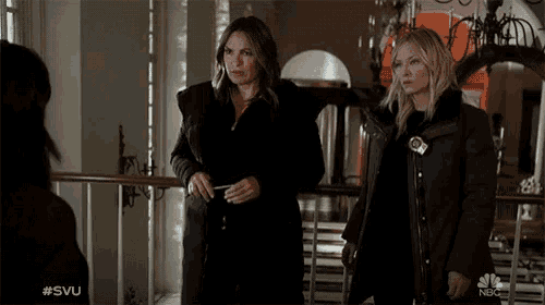 two women standing next to each other with a nbc logo in the corner
