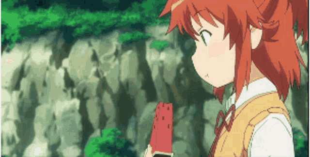a girl with red hair is eating a red watermelon