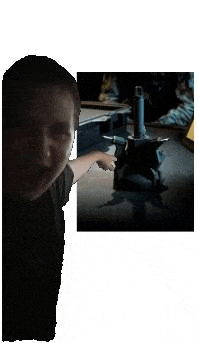 a man is holding a sword in front of a picture of a man holding a sword .