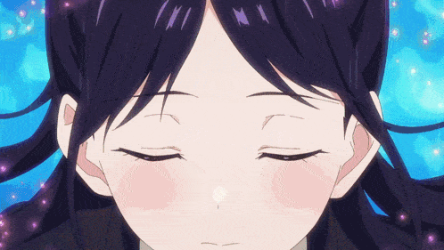 a close up of a girl 's face with her eyes closed and her hair blowing in the wind